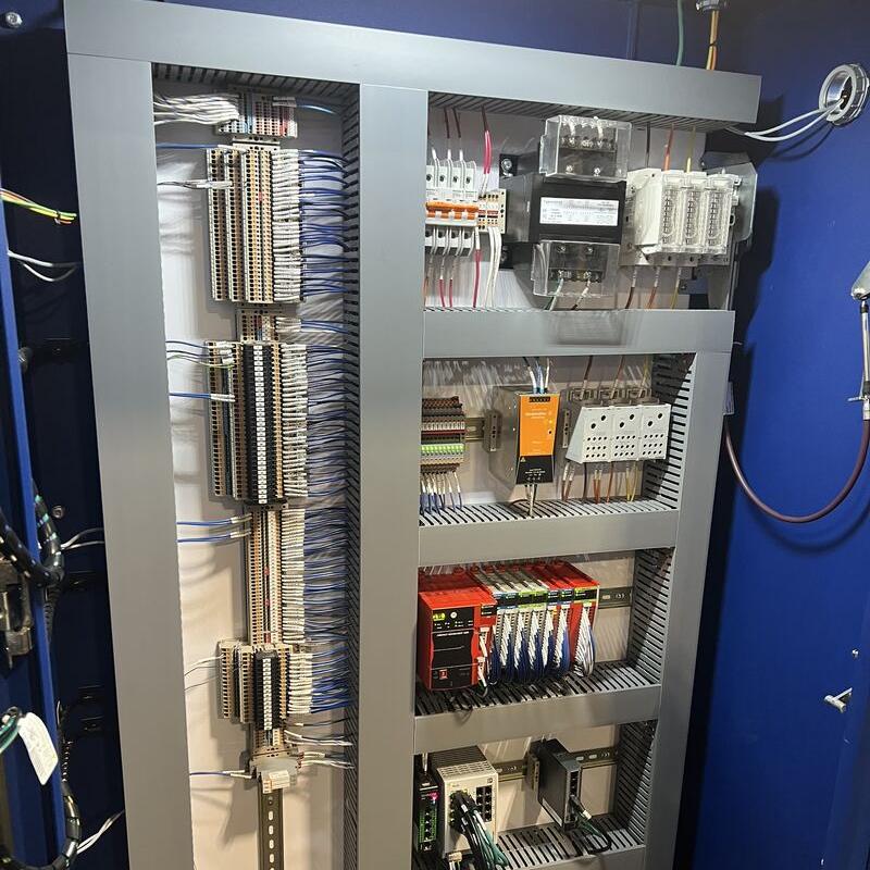 Safety PLC panel with long terminal strips, transformer, breakers and Ethernet switches